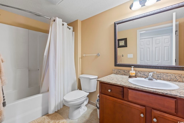 full bath with a textured ceiling, tile patterned flooring, vanity, toilet, and shower / bath combo with shower curtain