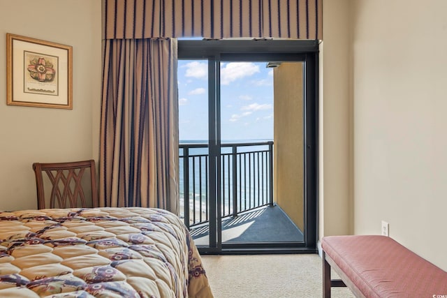 carpeted bedroom with access to outside