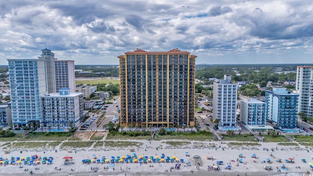 bird's eye view with a city view and a beach view