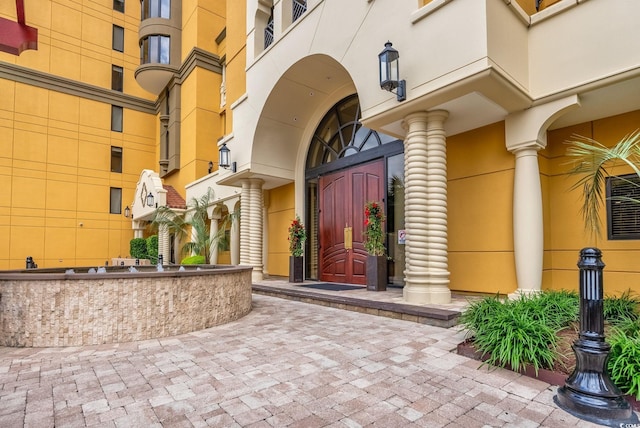 property entrance featuring stucco siding