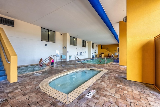 pool with a patio area