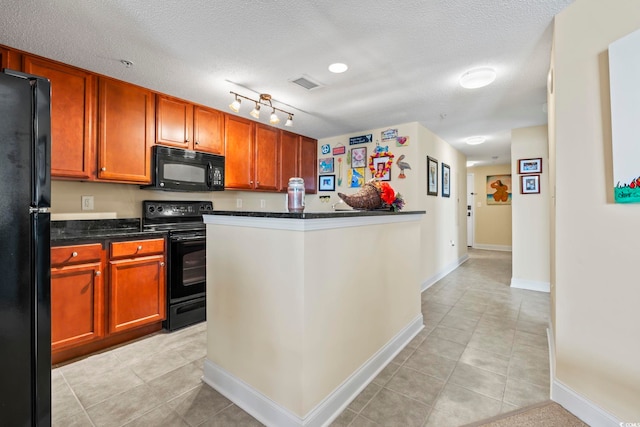 kitchen with visible vents, baseboards, a textured ceiling, light tile patterned floors, and black appliances
