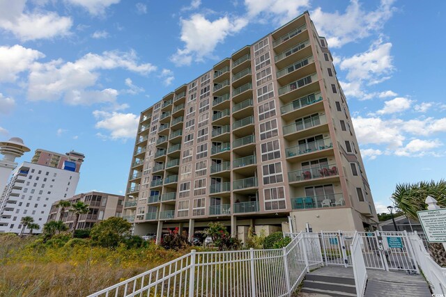 2507 S Ocean Blvd Unit 403, North Myrtle Beach, SC 29582 - view of building exterior with fence