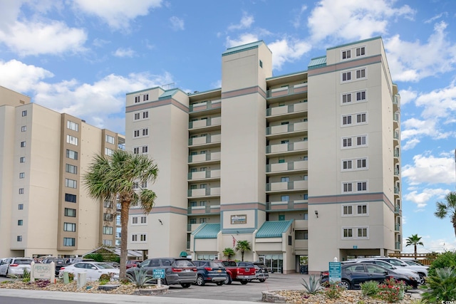 2507 S Ocean Blvd Unit 403, North Myrtle Beach, SC 29582 - view of building exterior with uncovered parking