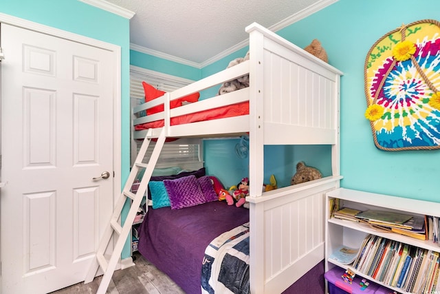 2507 S Ocean Blvd Unit 403, North Myrtle Beach, SC 29582 - bedroom with a textured ceiling, wood finished floors, and ornamental molding