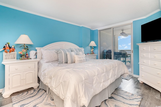 2507 S Ocean Blvd Unit 403, North Myrtle Beach, SC 29582 - bedroom with baseboards, ornamental molding, wood finished floors, and access to exterior