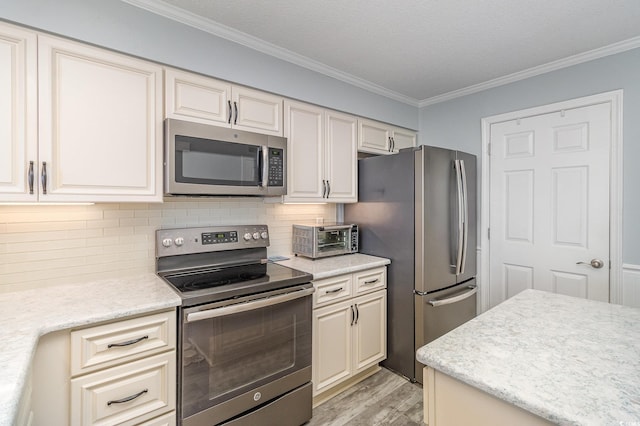 2507 S Ocean Blvd Unit 403, North Myrtle Beach, SC 29582 - kitchen featuring stainless steel appliances, ornamental molding, a toaster, light wood-style flooring, and backsplash