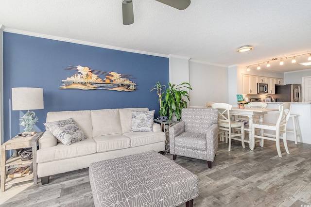 2507 S Ocean Blvd Unit 403, North Myrtle Beach, SC 29582 - living area featuring light wood finished floors, crown molding, a textured ceiling, and ceiling fan