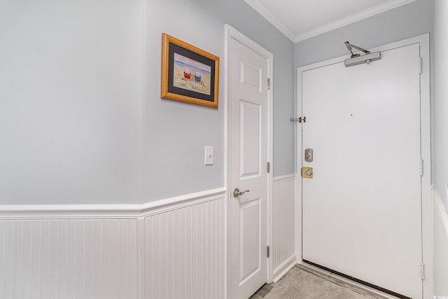2507 S Ocean Blvd Unit 403, North Myrtle Beach, SC 29582 - doorway featuring crown molding and a wainscoted wall
