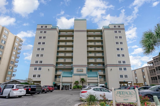 2507 S Ocean Blvd Unit 403, North Myrtle Beach, SC 29582 - view of building exterior featuring uncovered parking