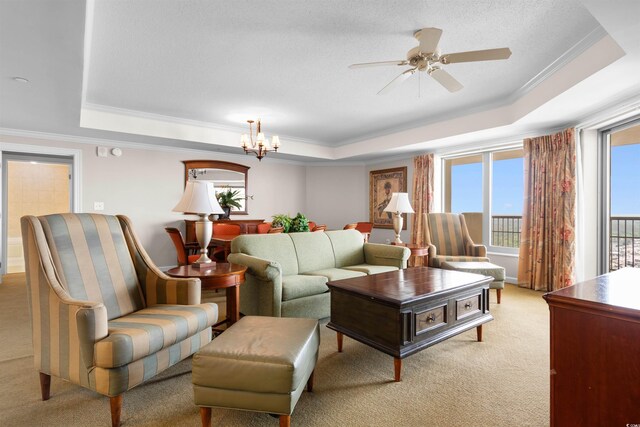 9994 Beach Club Dr Unit 2403, Myrtle Beach, SC 29572 - living area with a tray ceiling, light carpet, ornamental molding, a chandelier, and a ceiling fan