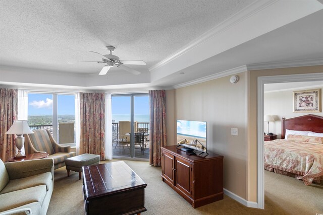 9994 Beach Club Dr Unit 2403, Myrtle Beach, SC 29572 - living area featuring ceiling fan, light carpet, a tray ceiling, ornamental molding, and a textured ceiling
