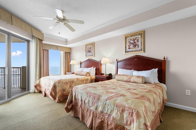 9994 Beach Club Dr Unit 2403, Myrtle Beach, SC 29572 - carpeted bedroom featuring access to exterior, crown molding, a ceiling fan, baseboards, and a tray ceiling