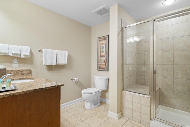 9994 Beach Club Dr Unit 2403, Myrtle Beach, SC 29572 - bathroom with tile patterned flooring, baseboards, toilet, vanity, and a stall shower