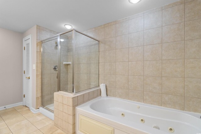 9994 Beach Club Dr Unit 2403, Myrtle Beach, SC 29572 - bathroom featuring a shower stall, a tub with jets, tile patterned flooring, and baseboards