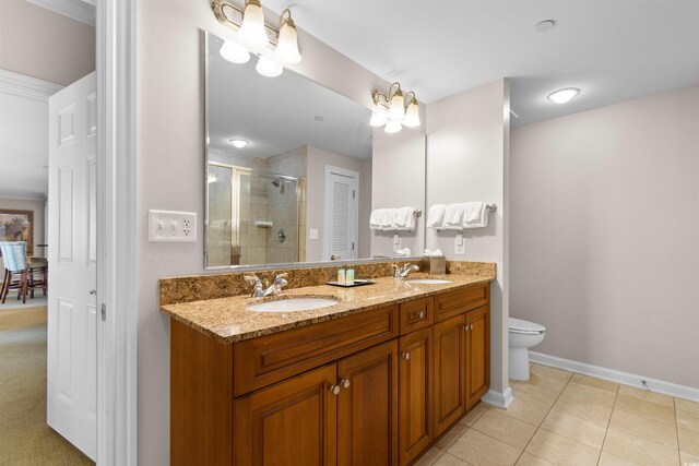 9994 Beach Club Dr Unit 2403, Myrtle Beach, SC 29572 - bathroom with double vanity, a stall shower, toilet, baseboards, and tile patterned flooring