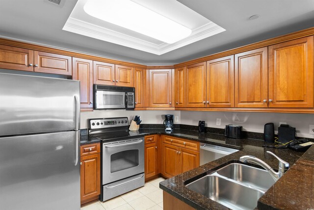9994 Beach Club Dr Unit 2403, Myrtle Beach, SC 29572 - kitchen with stainless steel appliances, a sink, and brown cabinets