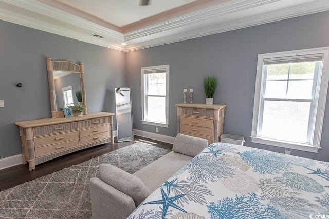 bedroom featuring visible vents, ornamental molding, dark wood-style floors, and multiple windows