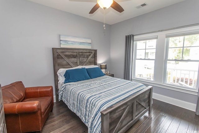 bedroom featuring baseboards, a ceiling fan, dark wood-style flooring, and visible vents