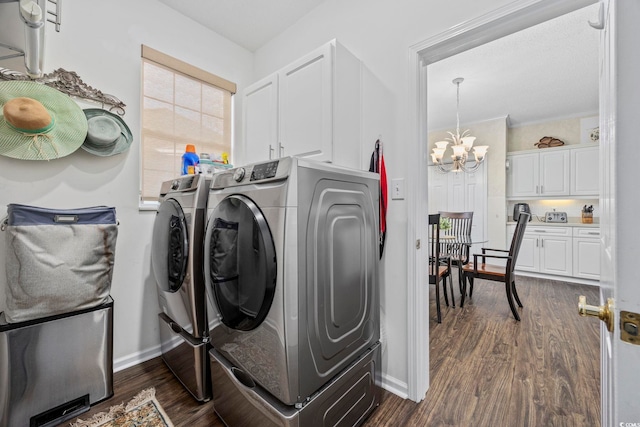 9628 Indigo Creek Blvd, Murrells Inlet, SC 29576 - washroom with washing machine and dryer, cabinet space, baseboards, a notable chandelier, and dark wood-type flooring