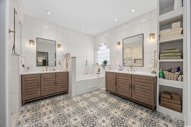 9628 Indigo Creek Blvd, Murrells Inlet, SC 29576 - full bathroom featuring tile walls, two vanities, a sink, and a garden tub