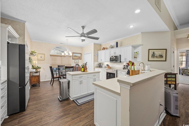 9628 Indigo Creek Blvd, Murrells Inlet, SC 29576 - kitchen featuring open shelves, light countertops, ceiling fan with notable chandelier, stainless steel appliances, and dark wood-type flooring
