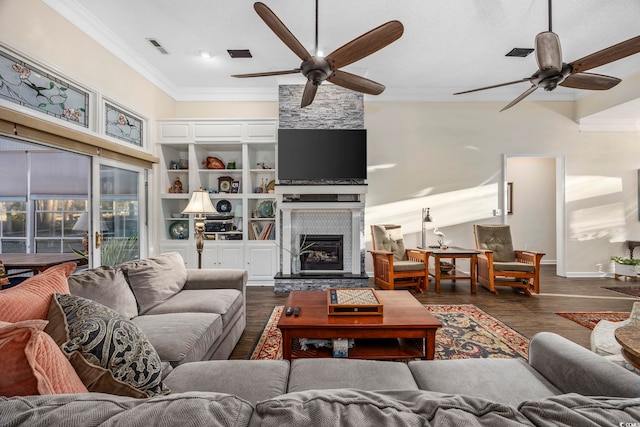 9628 Indigo Creek Blvd, Murrells Inlet, SC 29576 - living room featuring visible vents, a ceiling fan, a fireplace, and ornamental molding