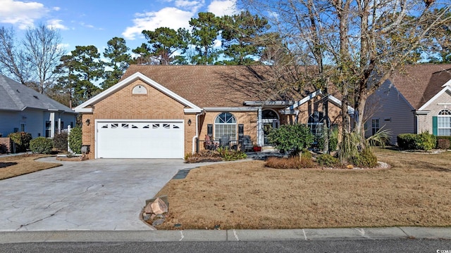 9628 Indigo Creek Blvd, Murrells Inlet, SC 29576 - single story home with concrete driveway, brick siding, and a garage