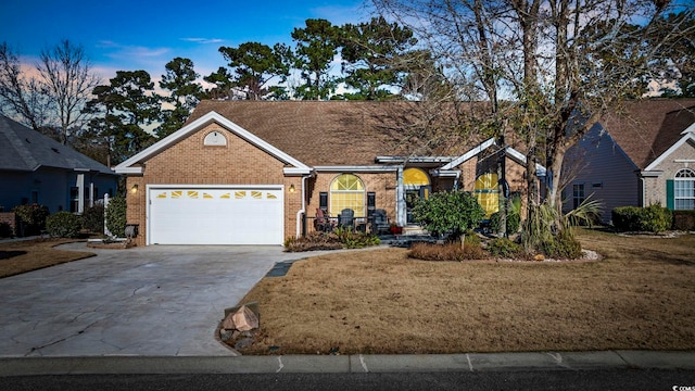 9628 Indigo Creek Blvd, Murrells Inlet, SC 29576 - ranch-style house with brick siding, an attached garage, and concrete driveway