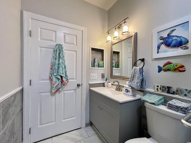 3979 Forsythia Ct Unit 203, Myrtle Beach, SC 29588 - half bathroom featuring marble finish floors, vanity, and toilet