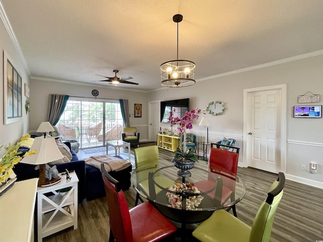 3979 Forsythia Ct Unit 203, Myrtle Beach, SC 29588 - dining space with ornamental molding, a textured ceiling, a chandelier, a ceiling fan, and dark wood-style flooring