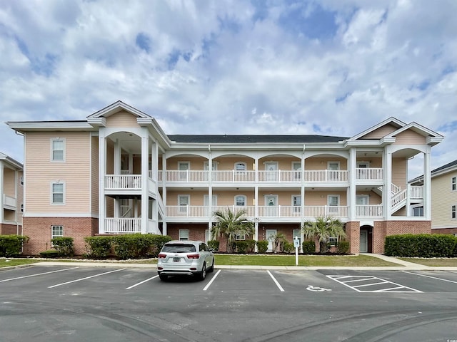 3979 Forsythia Ct Unit 203, Myrtle Beach, SC 29588 - view of building exterior featuring uncovered parking