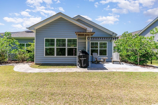 5581 Plantersville Pl, Myrtle Beach, SC 29579 - rear view of house with a patio area and a yard
