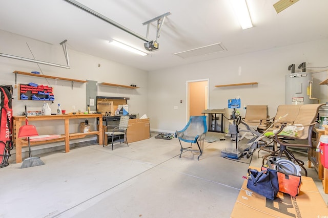 garage featuring electric water heater and a garage door opener