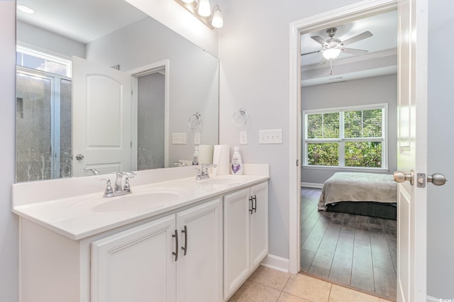 5581 Plantersville Pl, Myrtle Beach, SC 29579 - bathroom with double vanity, baseboards, tile patterned flooring, and a ceiling fan