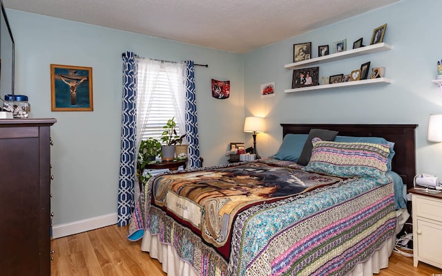 1015 Elm St Unit 18, Conway, SC 29526 - bedroom with light wood-style flooring and baseboards