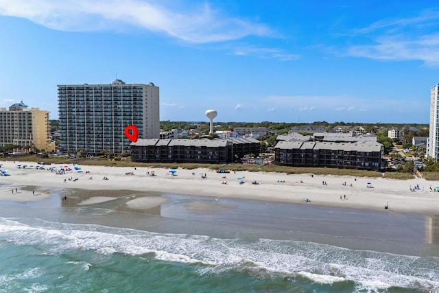 drone / aerial view with a beach view and a water view
