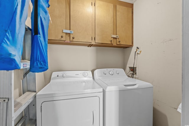 laundry room with cabinet space and independent washer and dryer