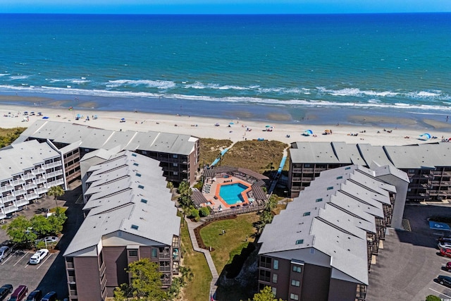 drone / aerial view with a water view and a view of the beach