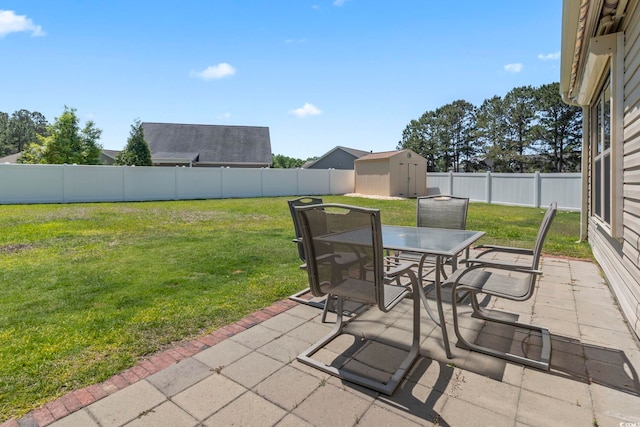 853 Derbyshire Ct, Conway, SC 29526 - view of patio featuring outdoor dining space, a storage unit, and an outbuilding