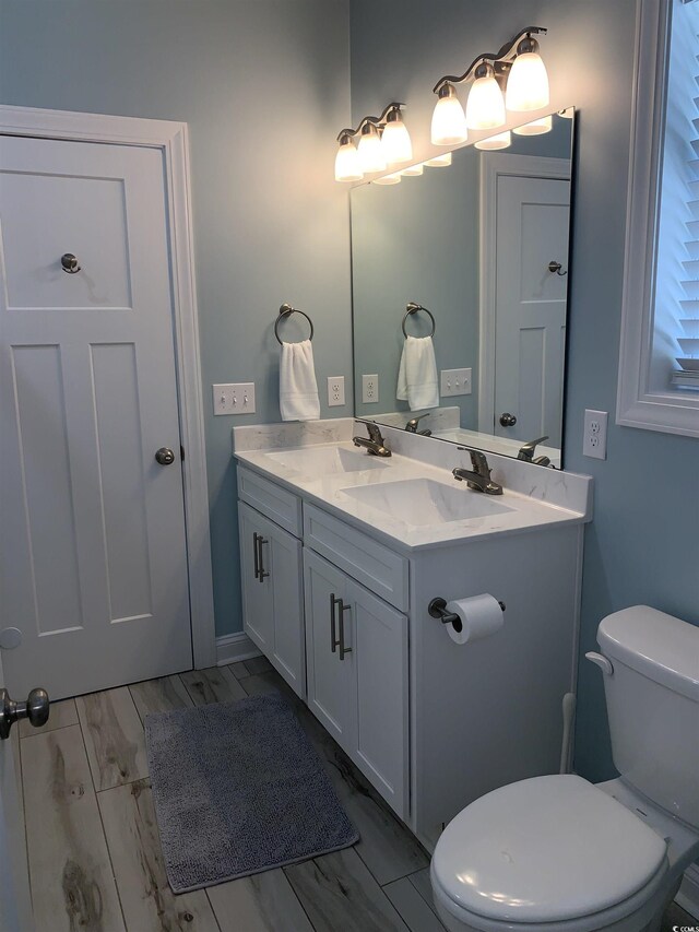 928STRANDAVE Strand Ave, North Myrtle Beach, SC 29582 - bathroom with double vanity, a sink, and toilet