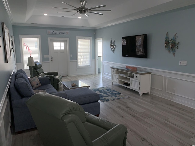 928STRANDAVE Strand Ave, North Myrtle Beach, SC 29582 - living area with wainscoting, ceiling fan, a tray ceiling, and light wood-style flooring