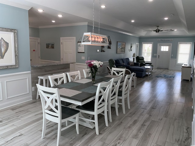 928STRANDAVE Strand Ave, North Myrtle Beach, SC 29582 - dining room featuring crown molding, light wood finished floors, and a decorative wall