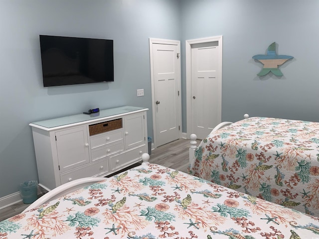 928STRANDAVE Strand Ave, North Myrtle Beach, SC 29582 - bedroom featuring baseboards and light wood finished floors