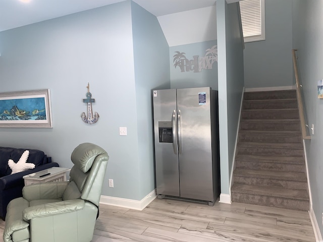 928STRANDAVE Strand Ave, North Myrtle Beach, SC 29582 - interior space featuring baseboards, open floor plan, light wood finished floors, and stainless steel fridge with ice dispenser