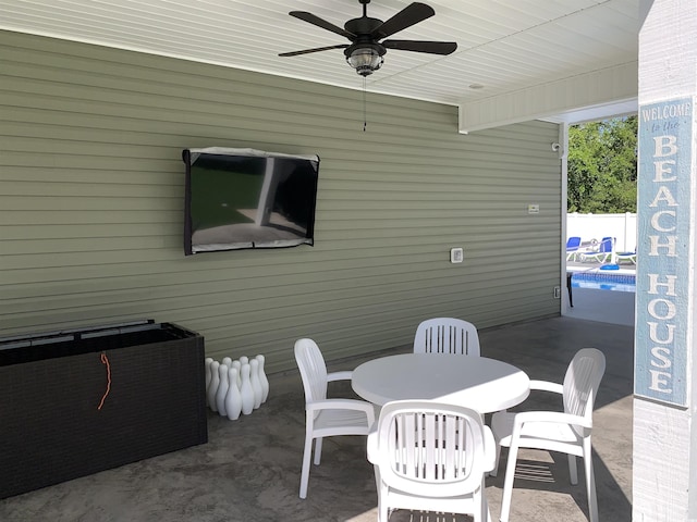 928STRANDAVE Strand Ave, North Myrtle Beach, SC 29582 - view of patio / terrace featuring a ceiling fan, outdoor dining space, and a pool