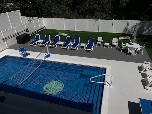 928STRANDAVE Strand Ave, North Myrtle Beach, SC 29582 - view of swimming pool with fence, a fenced in pool, a lawn, and a patio area
