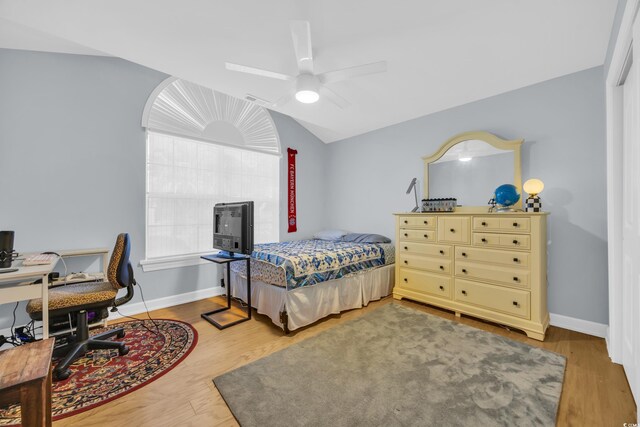 4104 Friendfield Trce, Little River, SC 29566 - bedroom with wood finished floors, vaulted ceiling, baseboards, a desk, and a ceiling fan