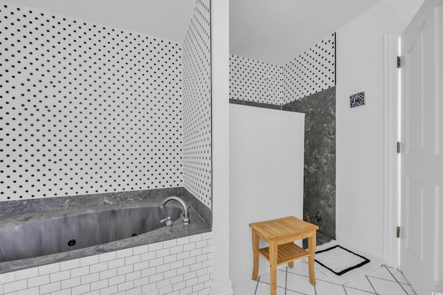 bathroom featuring a walk in shower, tile patterned floors, and a tub with jets