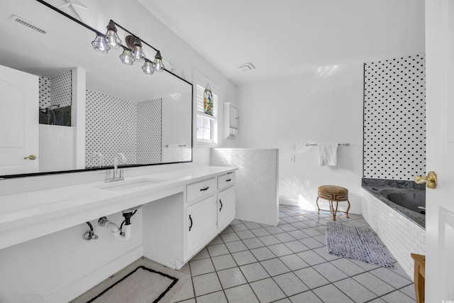 full bath featuring walk in shower, visible vents, a bath, tile patterned floors, and vanity